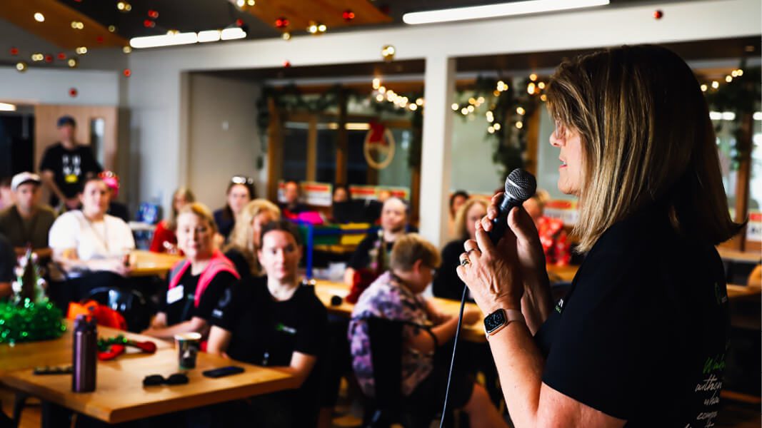 Woman speaking at Christmas event