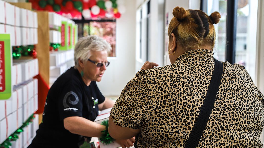 Two woman with Christmas gifts